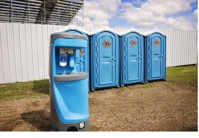 Portable restroom units near a lakefront property for a long-term rental