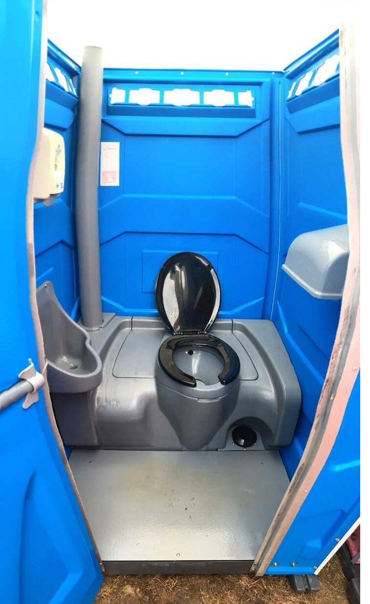 Interior view of an accessible portable toilet fixture
